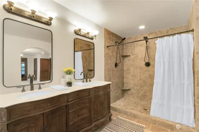 Beautiful double sink vanity and large walk in shower.