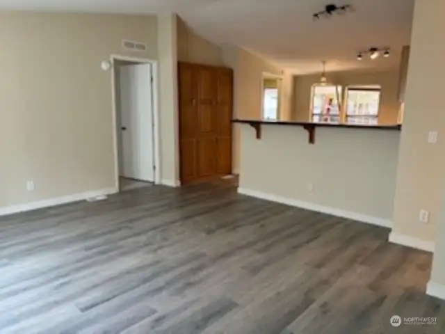 New flooring in living areas with vaulted ceiling