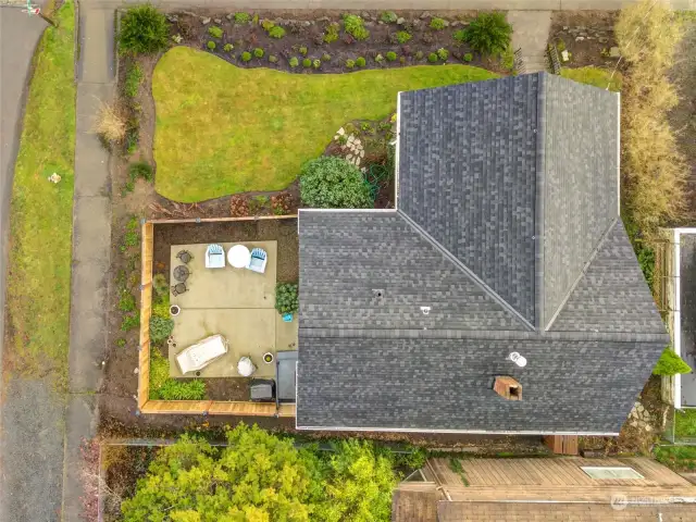 A bird' s-eye view of the spacious corner lot provides a perfect vantage point to admire the new roof with a transferable warranty, refreshed landscaping, and the fully fenced patio oasis.