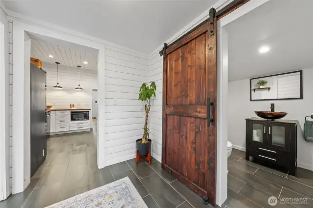 Adorable 1/2 bath laundry with barn door