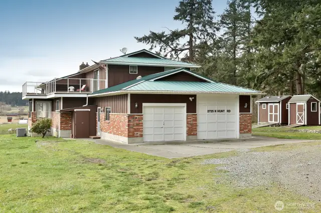 A sizeable 2 car garage with shop space and a large deck complement this home.
