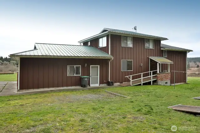 Back view and 3 sheds on lot as well as the barn on lot 2.