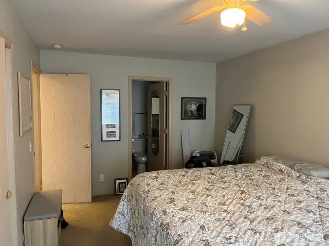 main floor second bedroom with on suite bathroom