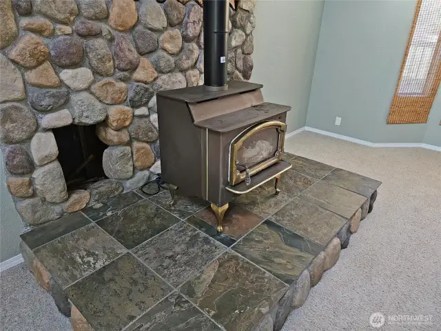 Nice river rock adornment around the wood stove