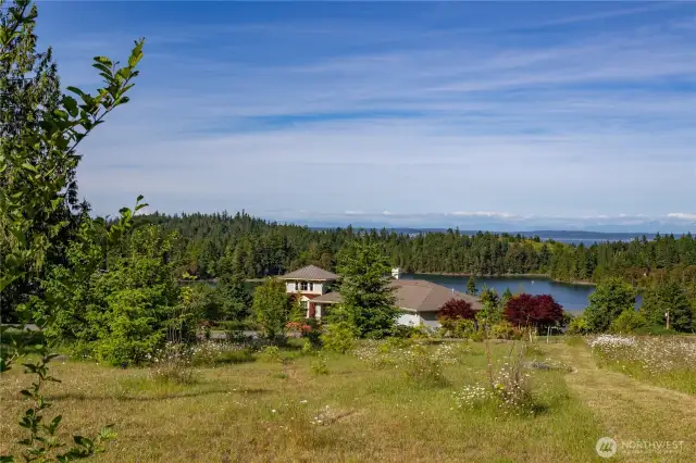 The mostly cleared lot has a gentle slope to the East. Public power and water are on the street, and there is a 3-bedroom drain field dedicated to this lot on a different parcel.