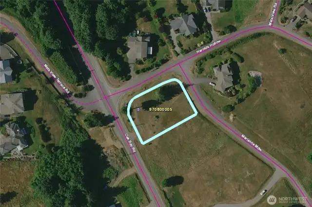 Lot five is outlined in this photo. The HOA has well-maintained homes, most lots are a half-acre or more, and this lot enjoys views of Mats Mats Bay and the Cascade  mountains.