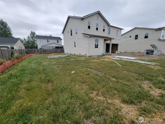 Tucked back in corner w/ large side yard.
