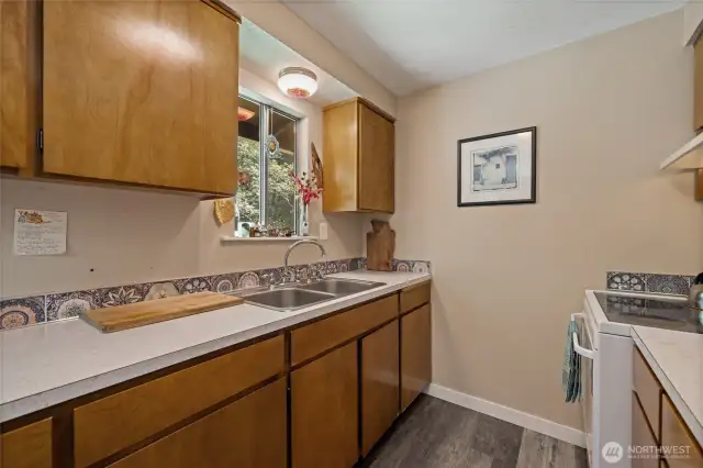 Look out onto your back patio and into your woods from this window above the sink.
