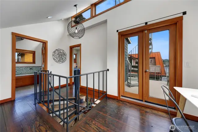 Work spaThe upstairs landing has soaring ceilings allowing massive light to fill in the space. ce or a peloton!
