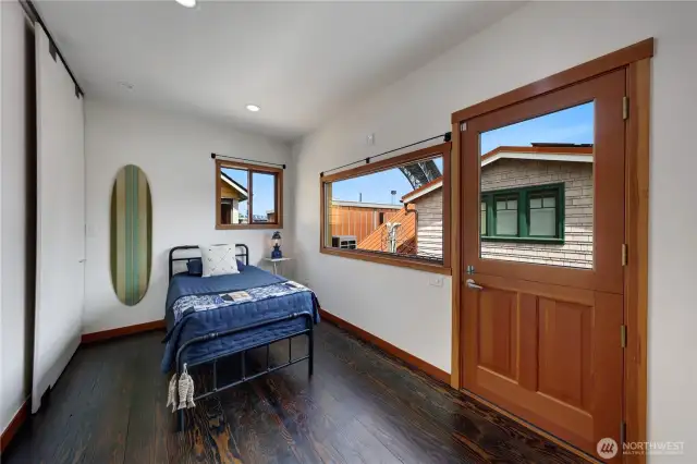 Guest bedroom, office, work out room - the list is long. We love the dutch door leading to one of the decks.