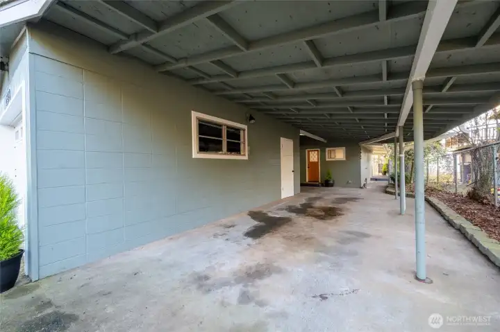 Covered parking, right of the garage with view toward main entrance.