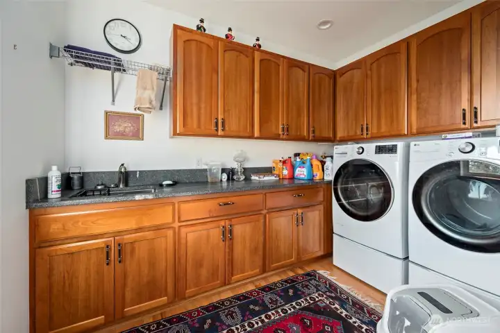 Laundry room with a pantry area just around the corner.