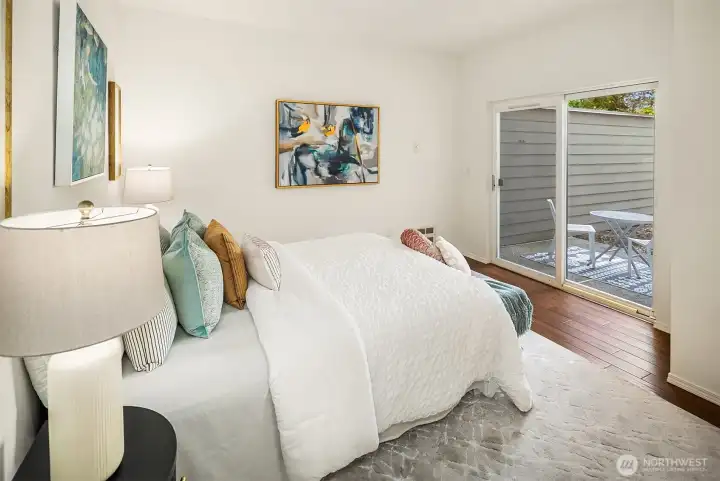 The Primary bedroom with doors directly to the private patio.