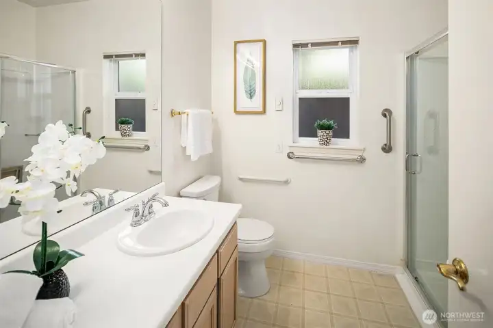 The 3/4 hall bath has a pull down bench seat in the walk-in shower.