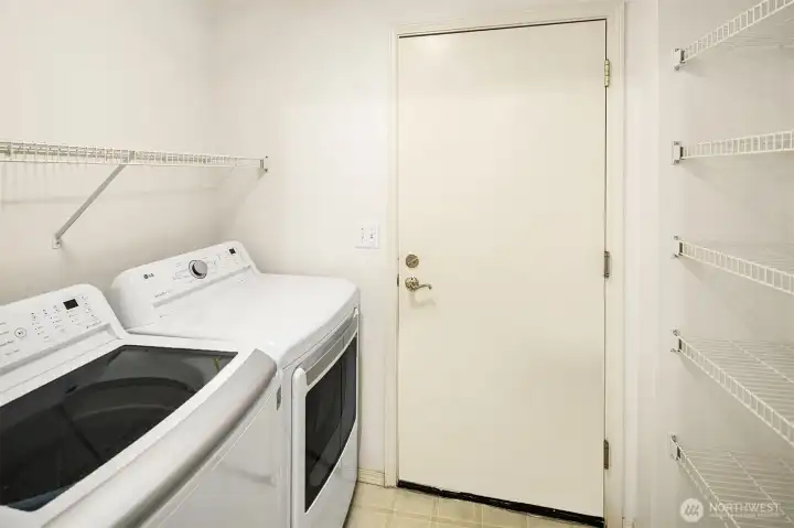 The utility room connects the garage to the kitchen. Lot's of shelves make unpacking groceries a breeze.