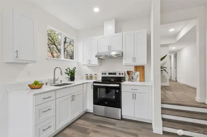 Fully renovated lower-level kitchen offering a separate and convenient cooking area, well suited for extended living arrangements or income potential.