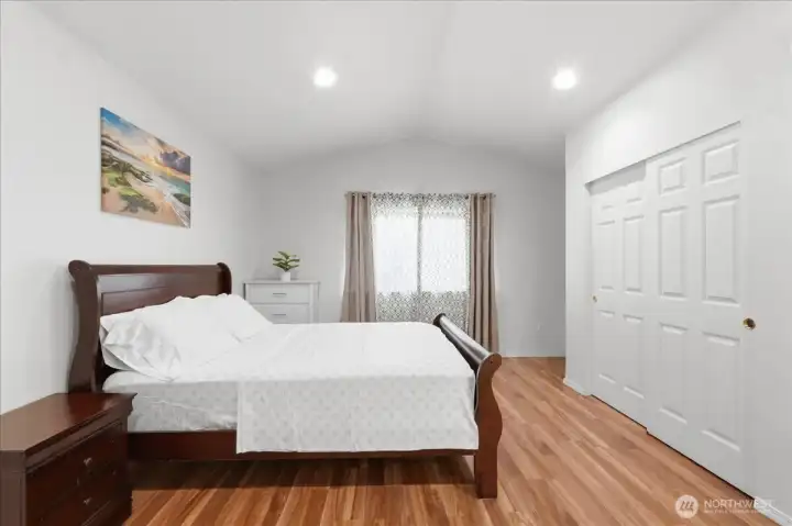 Primary suite with vaulted ceilings.