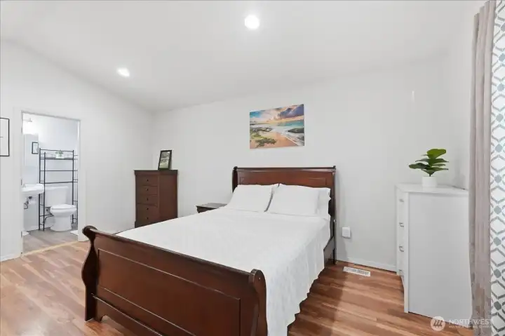 Primary bedroom and private bath.
