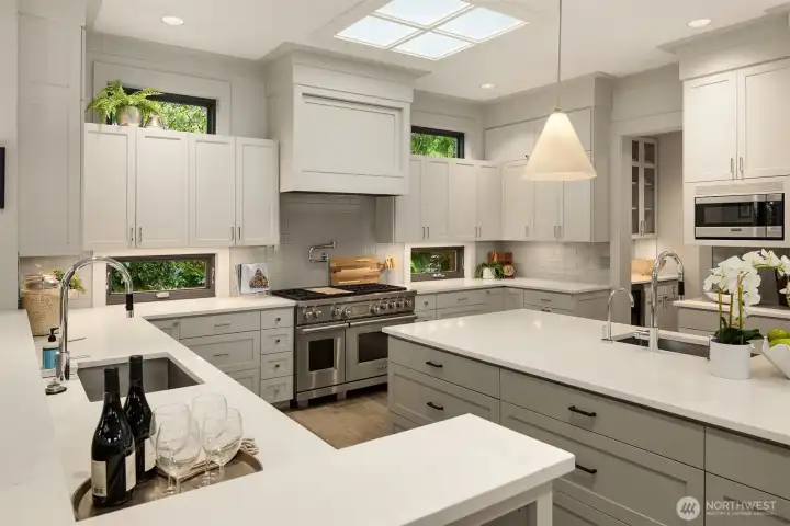 Epicureans will appreciate the grand kitchen, with well-placed windows and a skylight for maximum natural lighting.