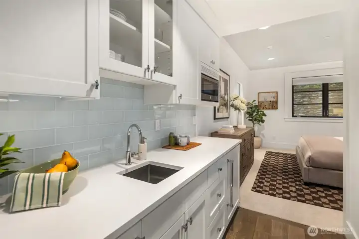 Ideal for guests or an au pair, the lower bedroom includes its own kitchenette.