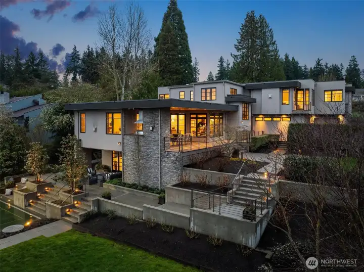 Thoughtfully designed outdoor areas utilize the space and privacy with a blend of hardscapes and curated landscaping.