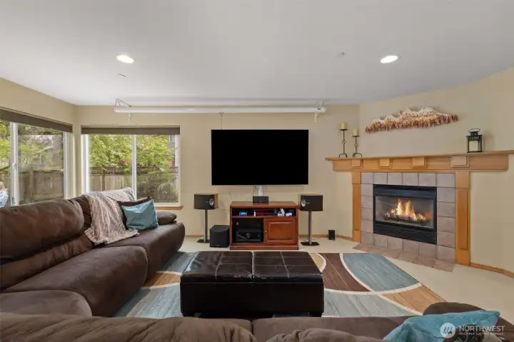 A corner fireplace anchors the family room and creates a cozy space.