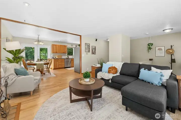 Living room flows into dining and kitchen