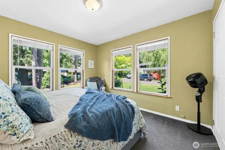 Main level bedroom #2 with big windows for natural light