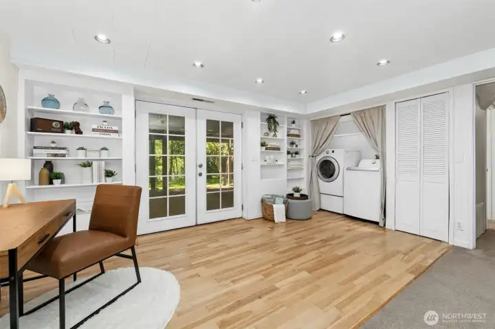 Laundry area and second set of French doors leading out to large backyard