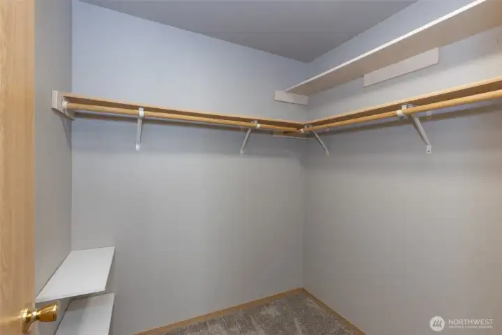 Primary bedroom walk in closet