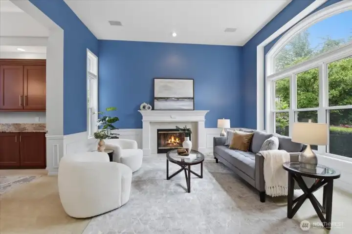 Spacious living room with large pictures windows and gas fireplace. Spacious living room with large pictures windows and gas fireplace.