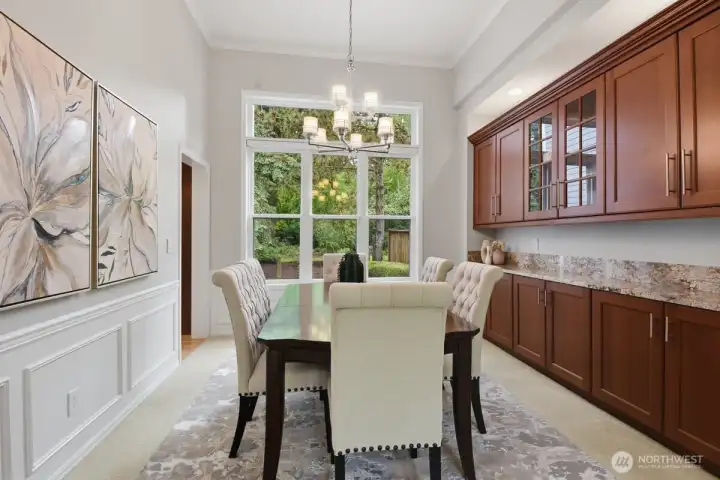 Spacious dining room that can comfortably accommodate an 8 top table. Notice the gorgeous built-in cabinetry. Spacious dining room that can comfortably accommodate an 8 top table. Notice the gorgeous built-in cabinetry.