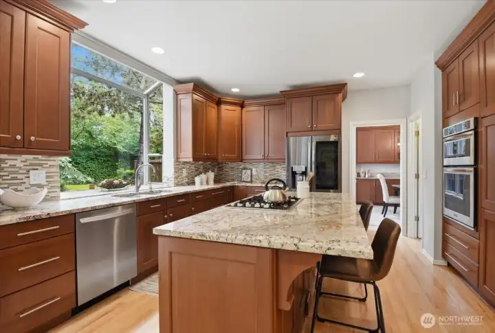 Chef's kitchen with an abundance of cabinets and counter space. There are 2 pantries and stainless appliances. Chef's kitchen with an abundance of cabinets and counter space. There are 2 pantries and stainless appliances.