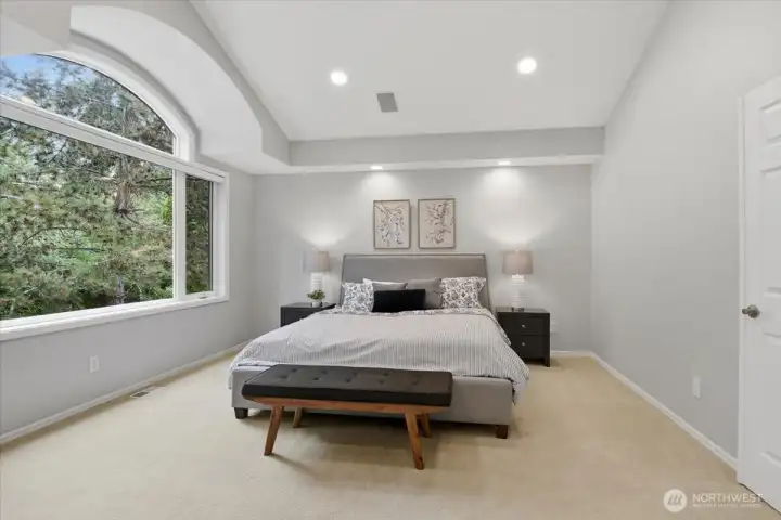 The expansive primary suite has vaulted ceilings. The expansive primary suite has vaulted ceilings.