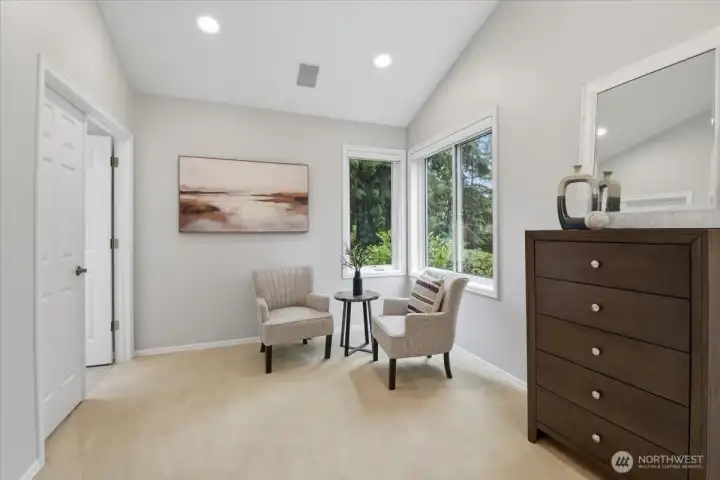 There is a sitting area in the primary suite. There is a sitting area in the primary suite.