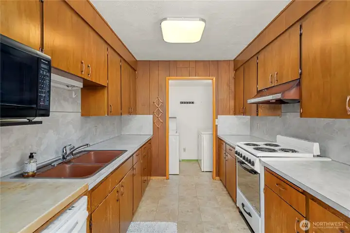 Lower level kitchen with seperate laundry.