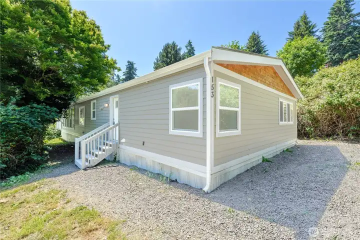 Front exterior with refreshed siding, cedar accents, and a welcoming entry that invites you home.
