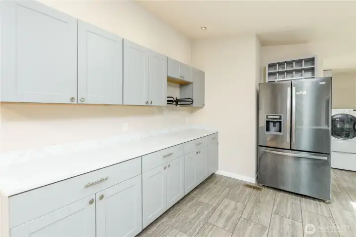 Kitchen offers abundant prep space, updated cabinetry, and views into the dining and living areas for easy everyday living.