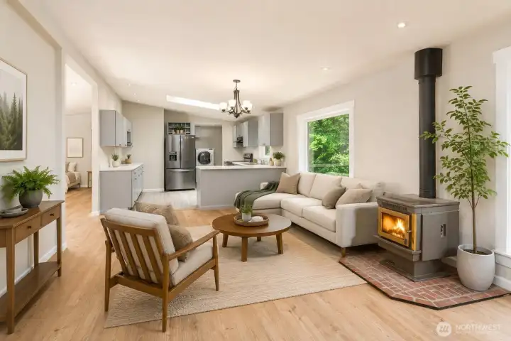 Virtual staging - Kitchen peninsula overlooks the dining area, showing a possible final installation of the pellet stove adding warmth and character to the main living space.