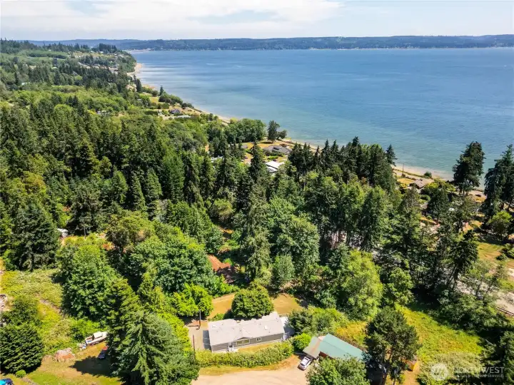 Experience the beauty of Port Ludlow from above, where peaceful wooded surroundings meet nearby shoreline access, creating the perfect balance of privacy and Pacific Northwest living.