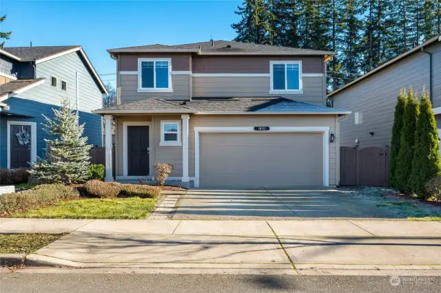 This home, better-than-new and beautifully updated, sits on a spacious lot, showcasing fresh paint and meticulously landscaped grounds that create an inviting atmosphere.