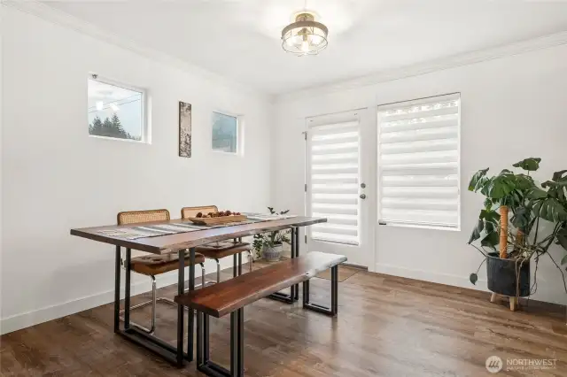 Dining room is open to the kitchen and family room and accesses the fenced yard!