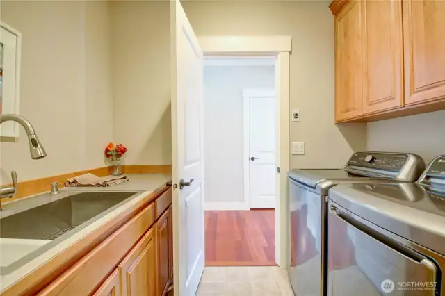 Laundry with plenty of storage, large sink.