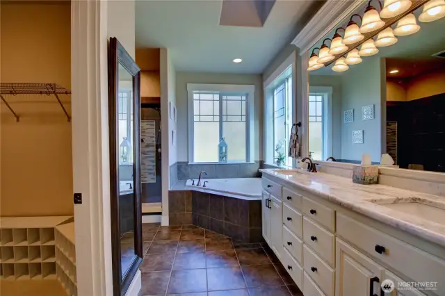 Large walk-in closet, double sinks w/granite countertops, jetted tub, tile accented shower.