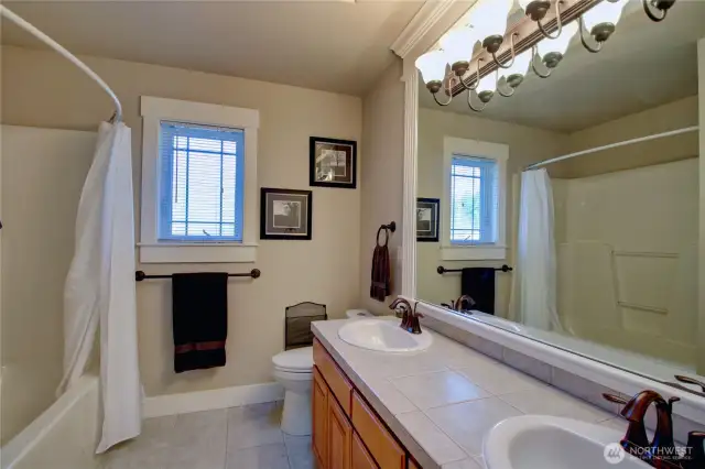 Upper level full bath with double sinks.