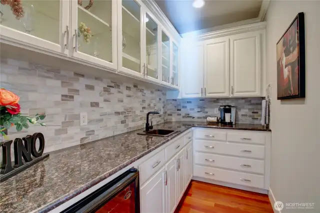 Butlers pantry with wine/beverage cooler.