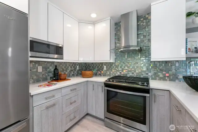 Updated kitchen throughout with stainless steel appliances and quartz countertops.