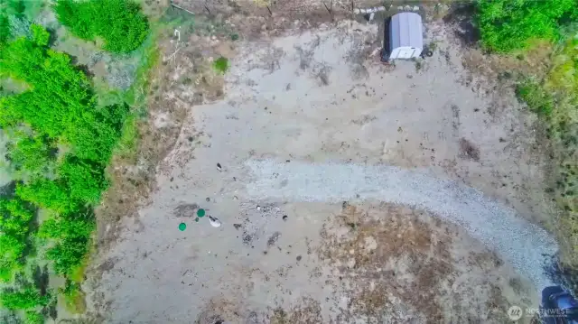Upper tier aerial view of excavated RV site ready area on 1.03 acre parcel