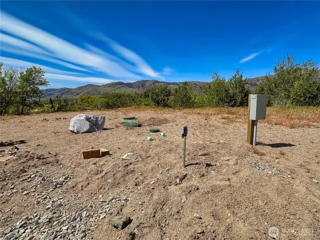 Upper tier site with 3 RV plugs (50amp/30amp/20amp), 1000gal septic & 2 domestic water spigots