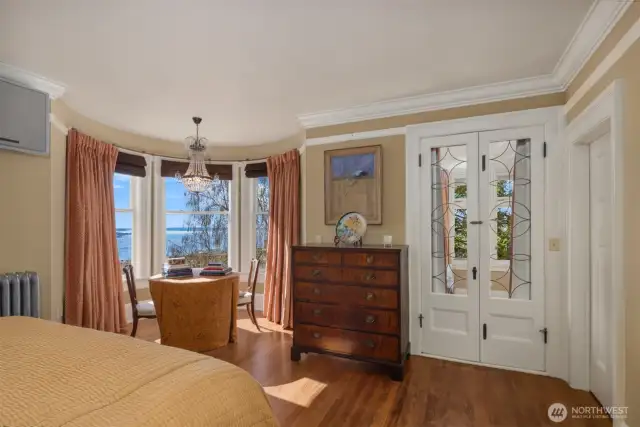Primary suite faces the city and sound views and has adjacent large view office and ensuite full bath and dressing area.